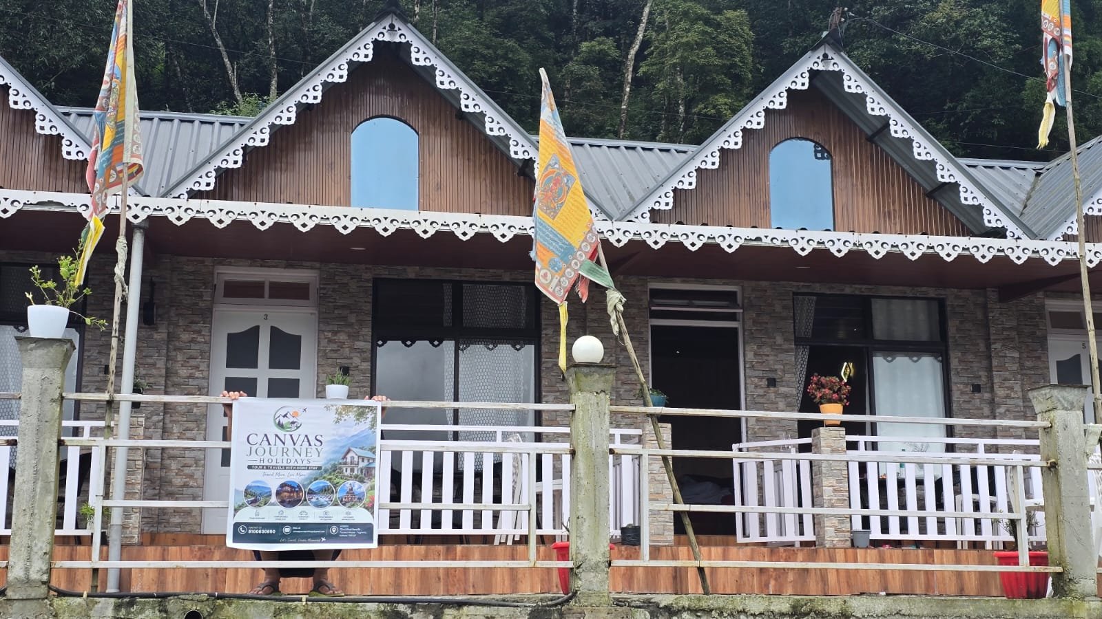 Drishya Home Stay, Sittong 3 — row of cottages lit up at dusk